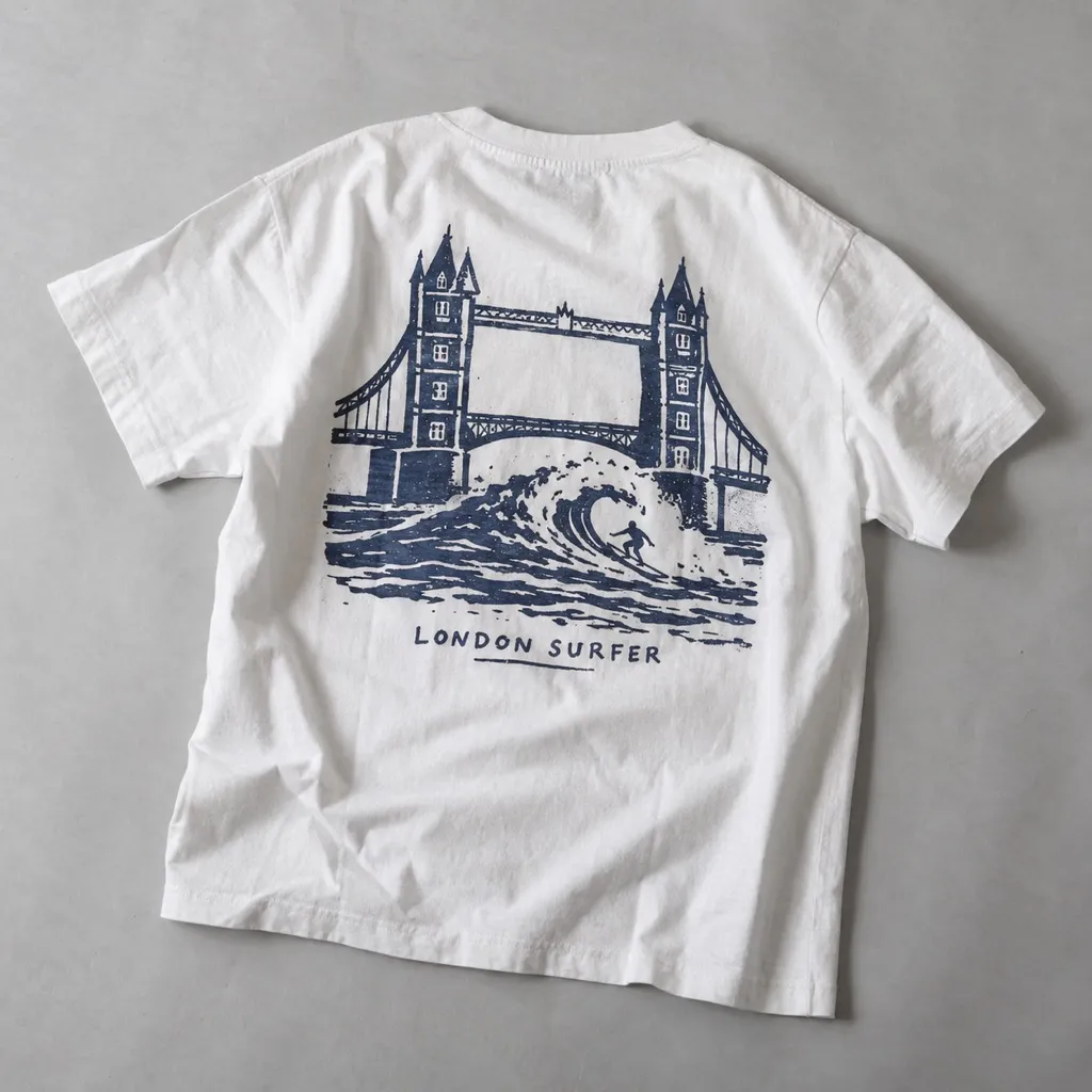 White T-shirt with a wave breaking under Tower Bridge printed on the back
